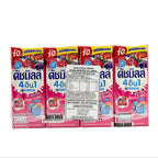 Four boxes of a fruit juice drink with colorful packaging on a white background