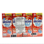 Four boxes of strawberry-flavored milk drink on a white background