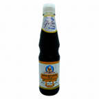 Bottle of black soy sauce with a label indicating it is gluten-free on a white background.