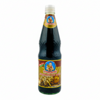 Bottle of mushroom soy sauce with a white background