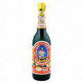 Bottle of sauce with a colorful label on a white background
