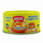 Can of Masari Masaman Curry Paste with yellow label and images of curry on a white background