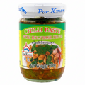 Jar of Por Kwan Chilli Paste with Holy Basil Leaves on a white background