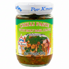 Jar of Por Kwan Chilli Paste with Holy Basil Leaves on a white background