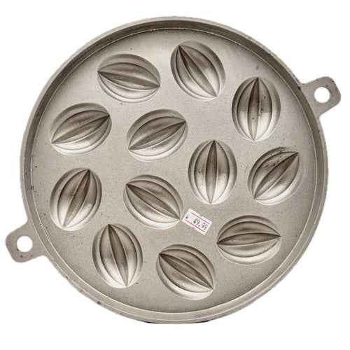 Aluminium 12 cavity Thai dessert mould bua loy on white background