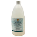 Bottle of body massage oil with a label on a white background