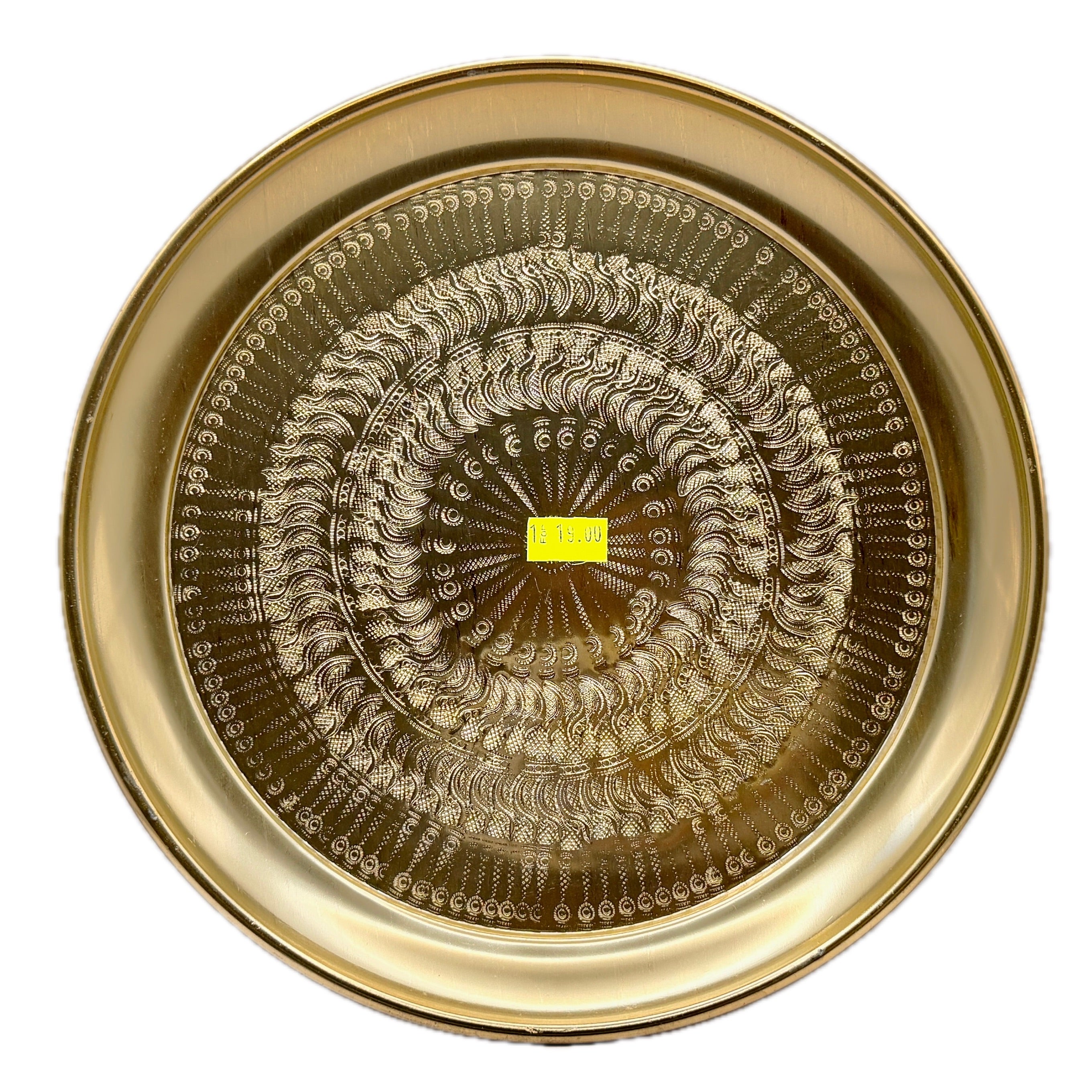 Gold Thai brass plate with intricate engraved traditional patterns on white background
