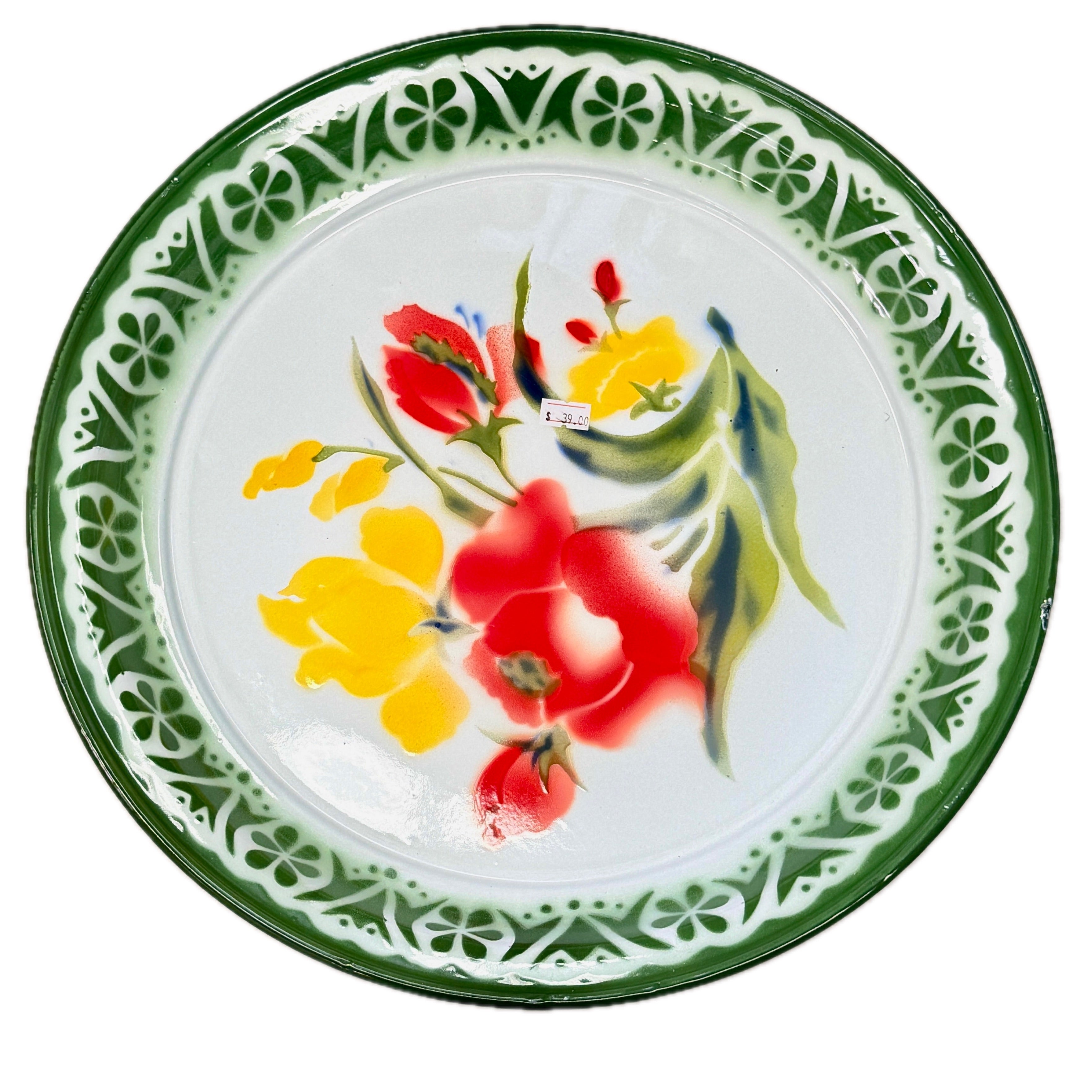 Thai enamel dinner plate with red and yellow floral design and decorative green border pattern in plastic wrap