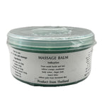 Container of massage balm with a white label on a white background