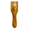 Natural teak wood perforated rice paddle spatula with holes on white background